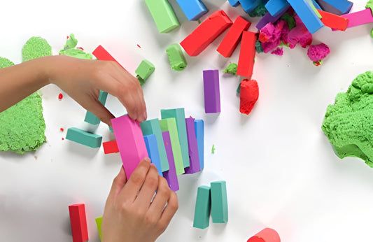 Hands building with colorful Mad Mattr blocks.