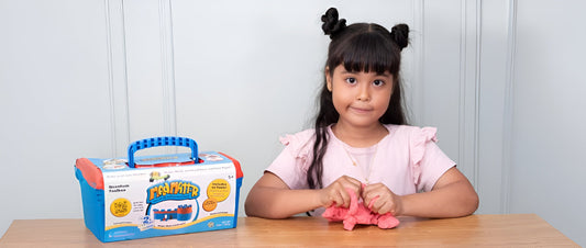 Close-up of a child shaping squishy Mad Mattr dough, illustrating sensory play and creativity for the Mad Mattr educational blog.