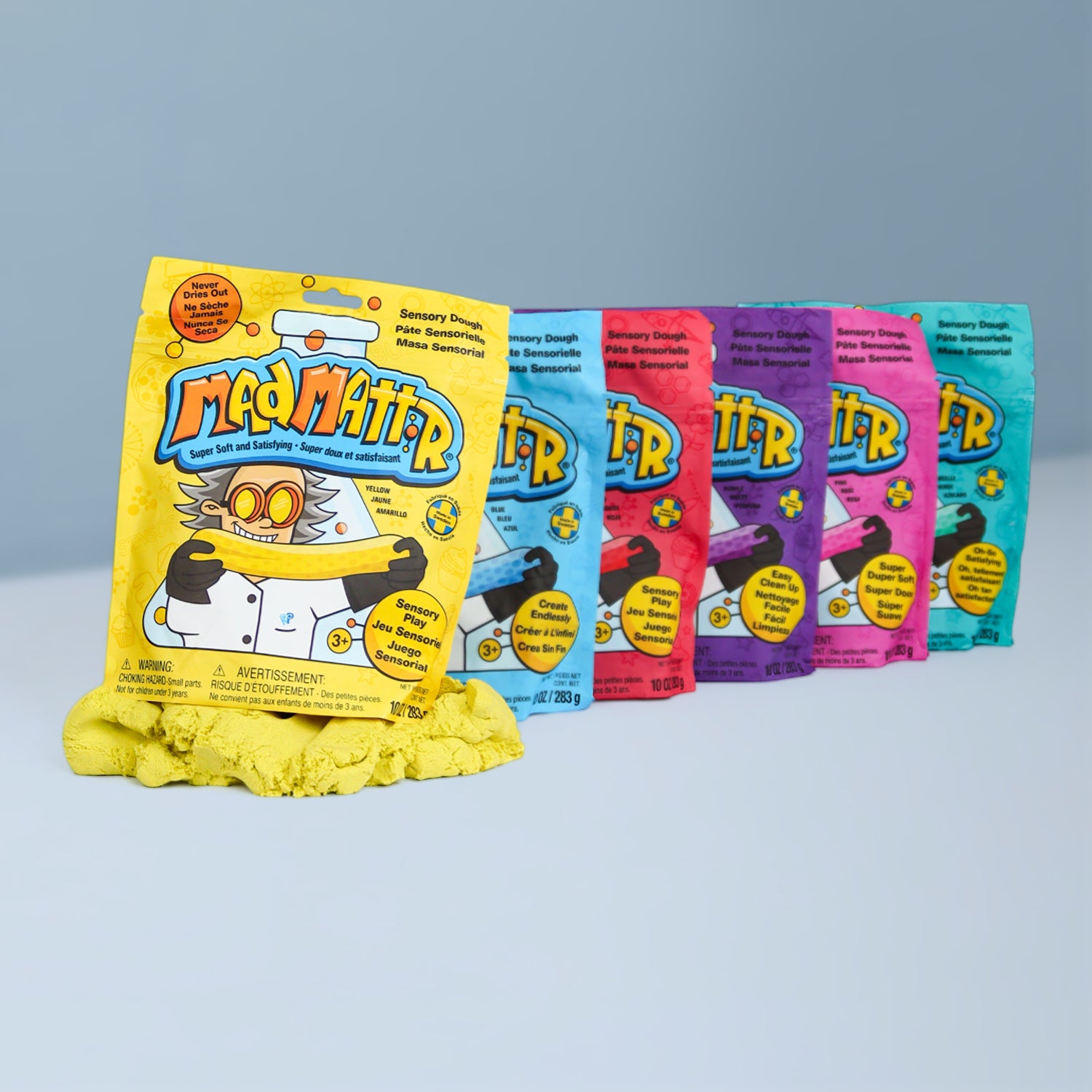 Mad Mattr Quantum Pack non toxic sensory dough set featuring 6 vibrant colors (yellow, blue, red, purple, pink, and teal). Mess-free, never-drying sensory play compound for kids, ideal for creative play, fine motor skills, and screen-free learning.