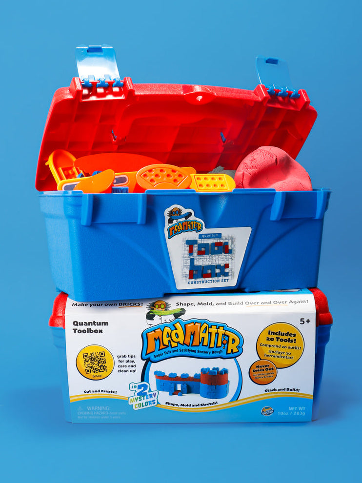 MadMattr Quantum Toolbox sensory play kit featuring a blue carrying case with a red lid. The set includes 20 tools and 10 ounces of super soft sensory dough, perfect for creative, screen-free construction play.
